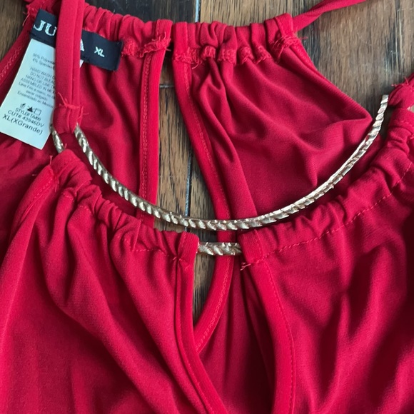 Size XL (definitely fits like Large) dressy “go out” tank.  See below - Picture 3 of 3